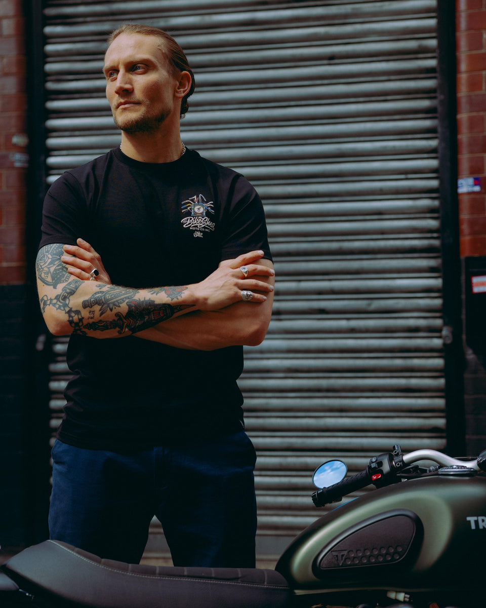 model wearing black motorcycle graphic t-shirt